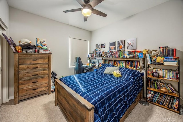 bedroom with ceiling fan and light carpet