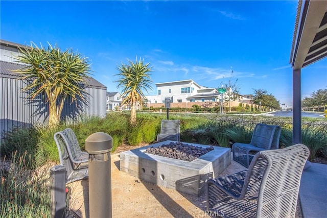 view of patio / terrace with an outdoor fire pit