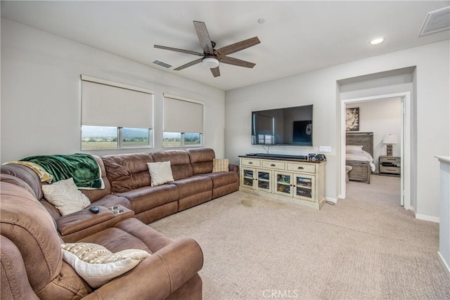 living room with ceiling fan and light carpet