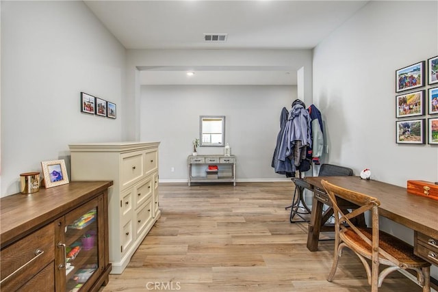 office space with light wood-type flooring