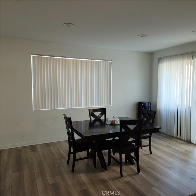 dining area with hardwood / wood-style floors