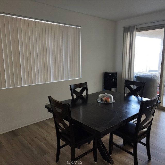 dining space featuring hardwood / wood-style floors