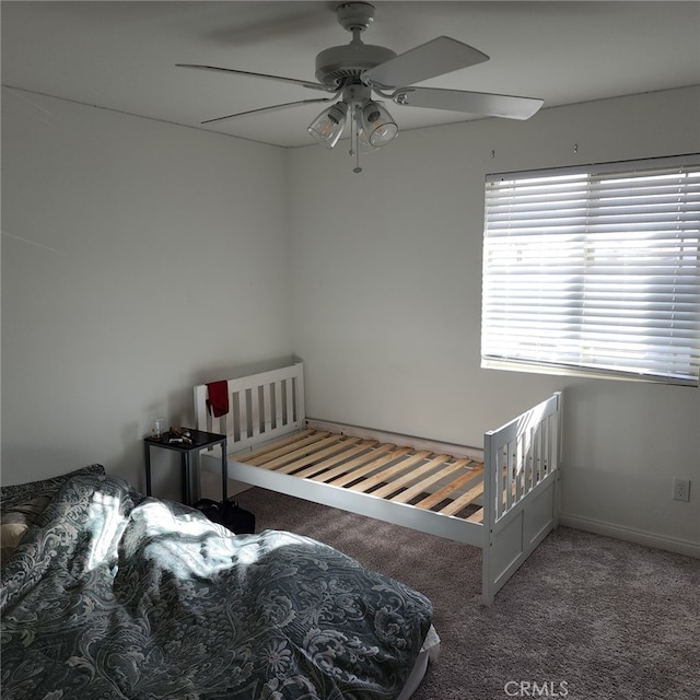 bedroom featuring ceiling fan and carpet flooring