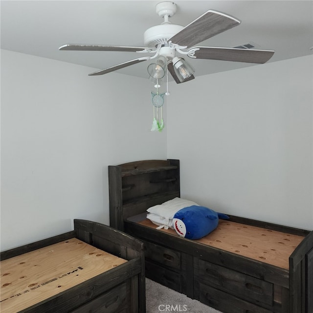 bedroom featuring ceiling fan and carpet floors