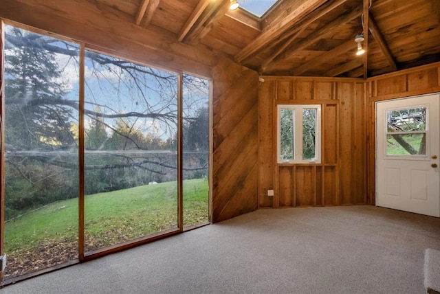 unfurnished sunroom featuring wooden ceiling and lofted ceiling with skylight