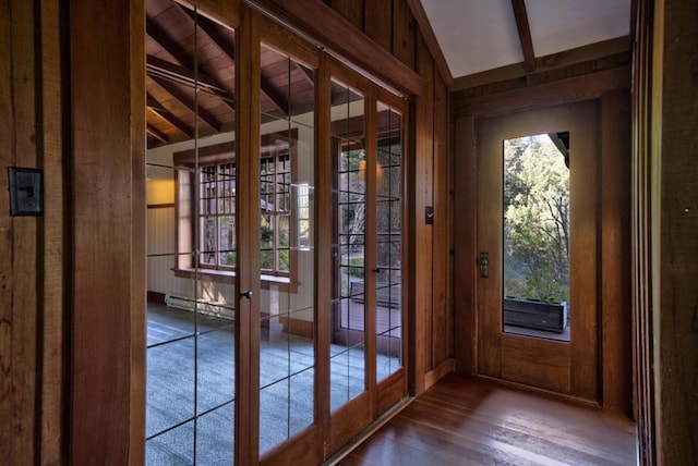 entryway featuring wood ceiling, french doors, wooden walls, lofted ceiling with beams, and hardwood / wood-style flooring