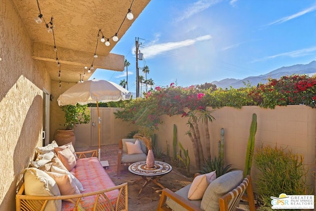 view of patio / terrace with a mountain view