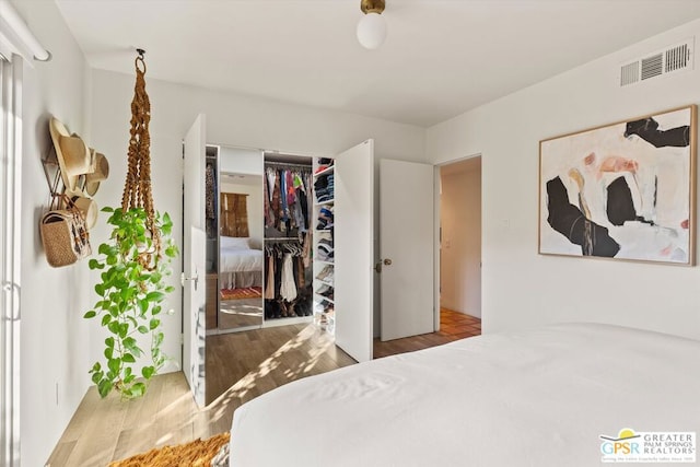 bedroom featuring a closet and light hardwood / wood-style flooring