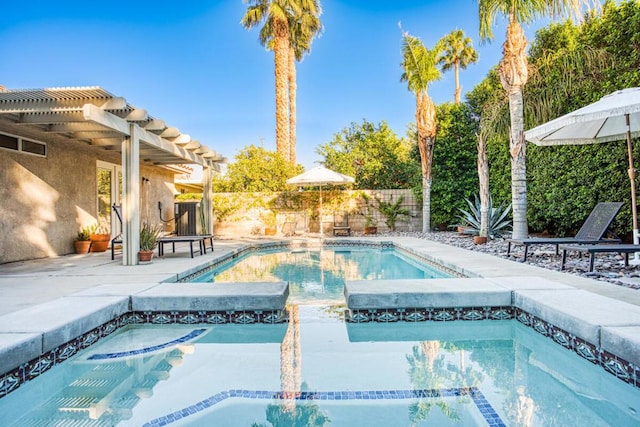 view of swimming pool with a pergola, an in ground hot tub, and a patio