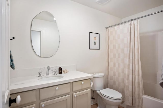 full bathroom featuring vanity, toilet, and shower / bath combo with shower curtain