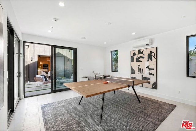 playroom featuring a wall mounted air conditioner