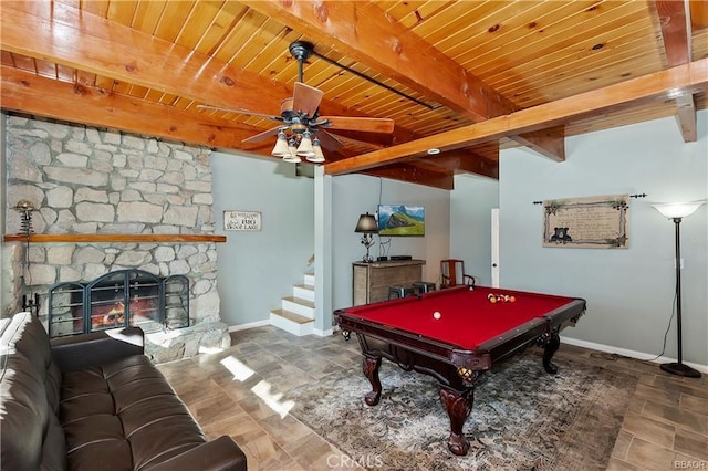 recreation room with beamed ceiling, a fireplace, billiards, ceiling fan, and wooden ceiling