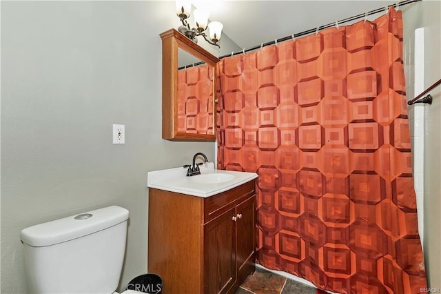 bathroom with toilet, an inviting chandelier, vanity, and curtained shower