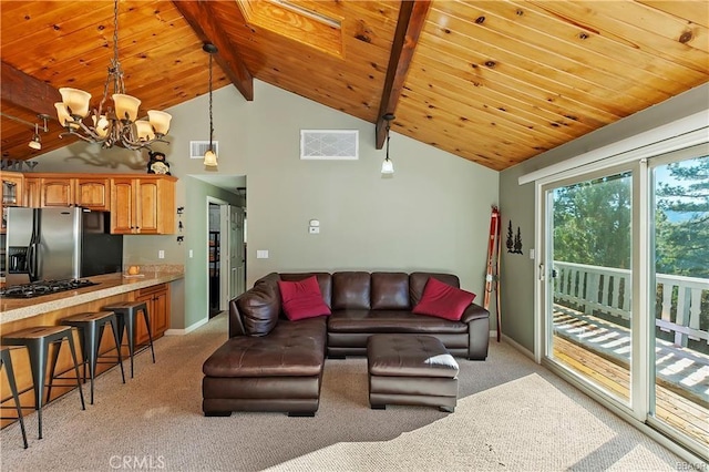 living room with light carpet, a skylight, beam ceiling, and a notable chandelier