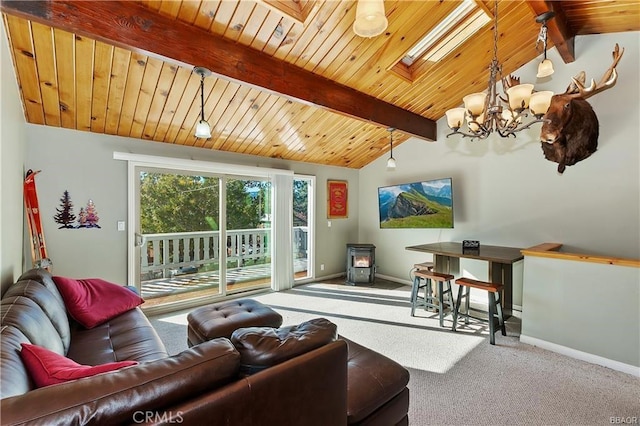 living room featuring carpet floors, vaulted ceiling with skylight, wood ceiling, and a wood stove