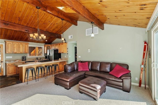 living room with lofted ceiling with beams, wood ceiling, a chandelier, and dark colored carpet