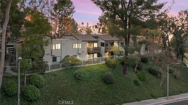 view of front of home featuring a balcony