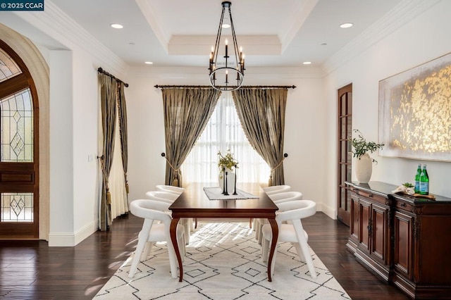 interior space with dark wood-type flooring, crown molding, a raised ceiling, and a notable chandelier