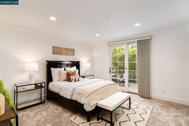 carpeted bedroom with crown molding, access to outside, and french doors