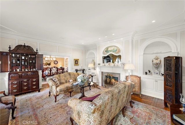 living room featuring a premium fireplace, parquet floors, and ornamental molding