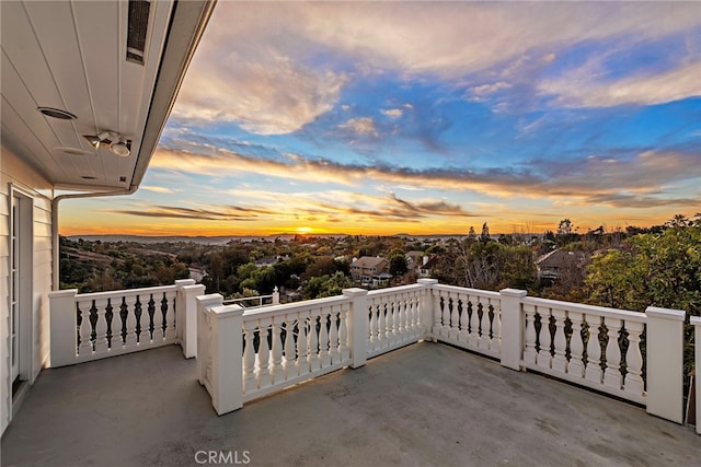 view of balcony at dusk