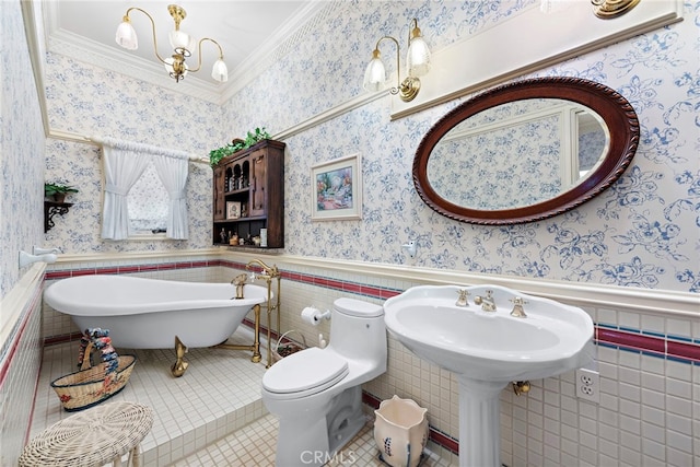 bathroom with toilet, a bathing tub, tile walls, tile patterned floors, and ornamental molding