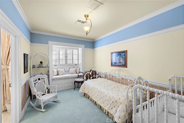 carpeted bedroom with ornamental molding