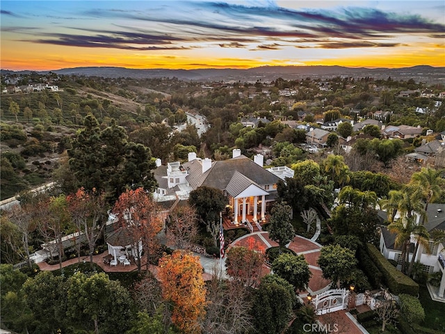 aerial view at dusk with a mountain view