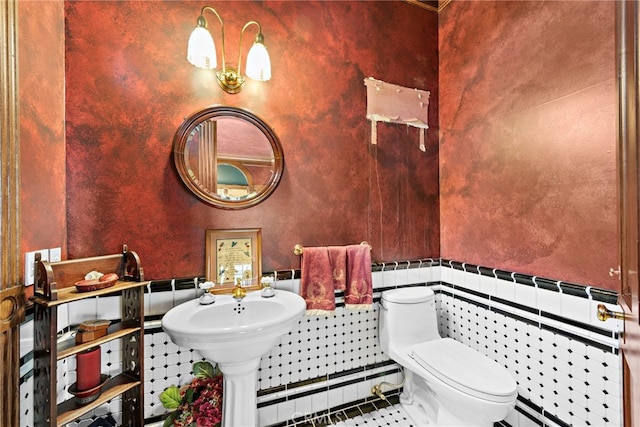 bathroom featuring baseboard heating, tile patterned floors, and toilet