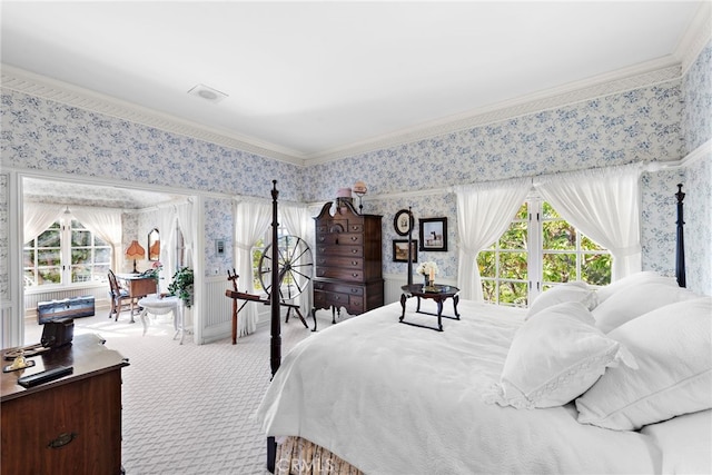 carpeted bedroom with crown molding