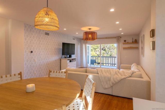 dining area featuring light wood-type flooring