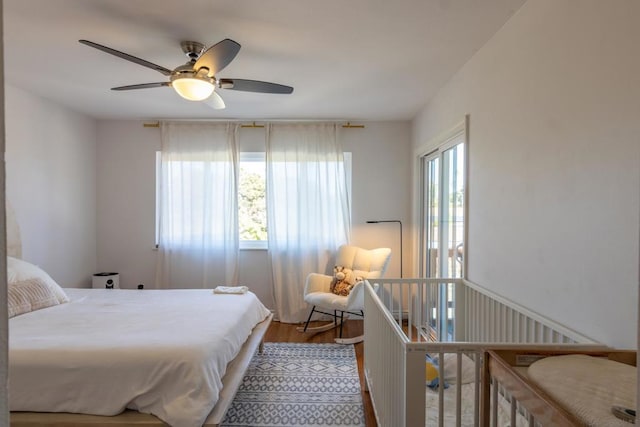 bedroom with ceiling fan and light wood-type flooring