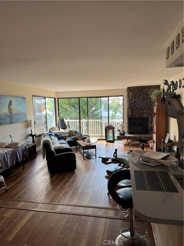 living room featuring a fireplace and wood-type flooring