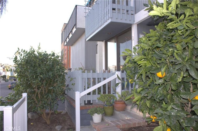 view of side of property with a balcony