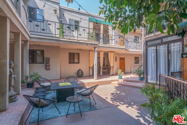 view of patio with a balcony