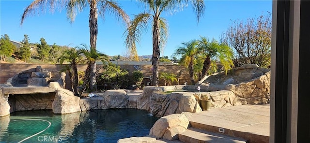 view of pool with pool water feature