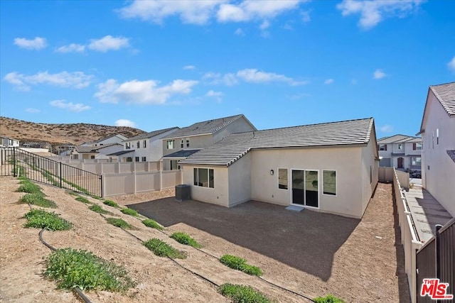 back of property featuring a patio area