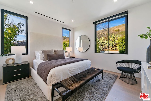 bedroom with light wood-type flooring