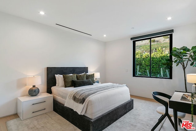 bedroom featuring light wood-type flooring