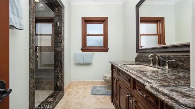 bathroom featuring ornamental molding, toilet, vanity, and walk in shower