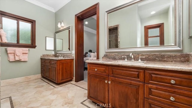 bathroom with ornamental molding and vanity