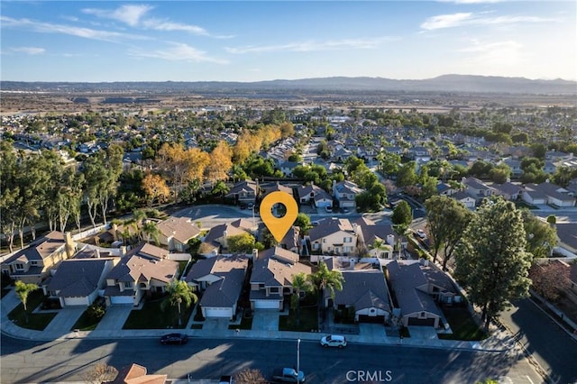 birds eye view of property featuring a mountain view