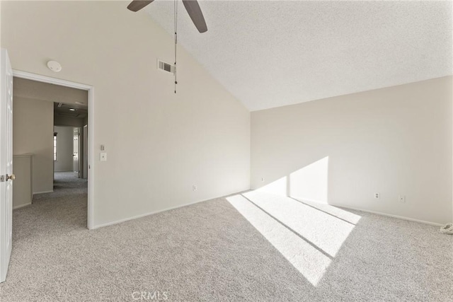 empty room with ceiling fan, a textured ceiling, and carpet flooring