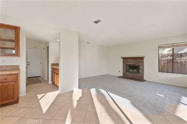 unfurnished living room with light tile patterned floors