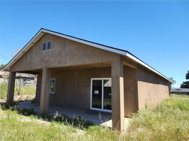 back of house featuring a patio area