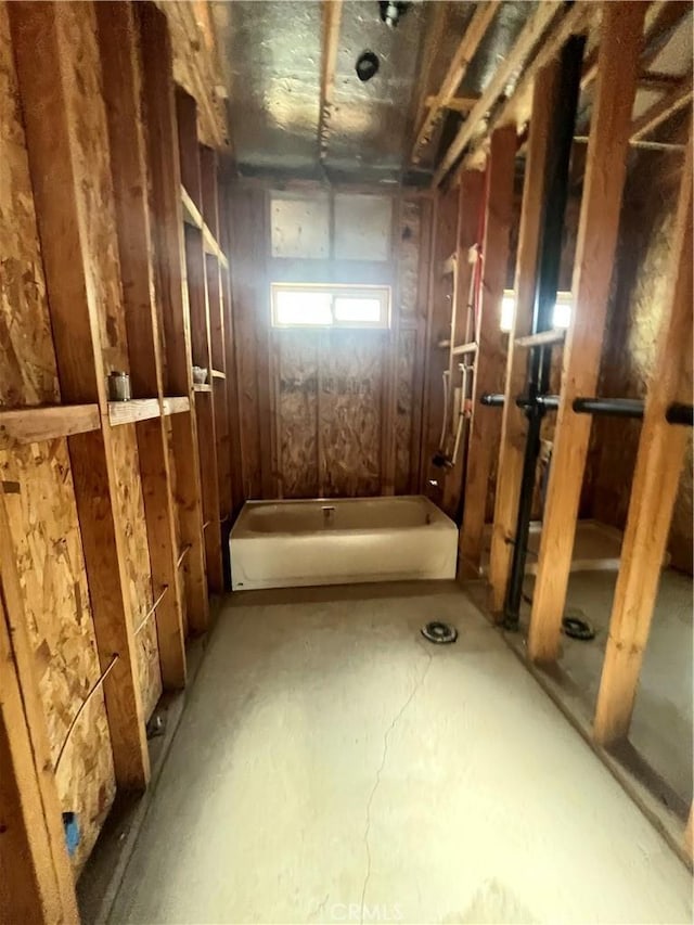 bathroom featuring a tub to relax in