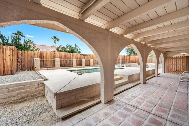 view of patio / terrace featuring a fenced in pool