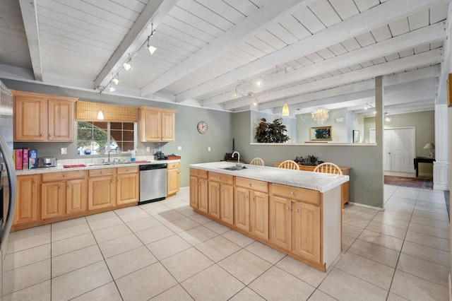 kitchen featuring dishwasher, a kitchen island with sink, sink, hanging light fixtures, and beamed ceiling