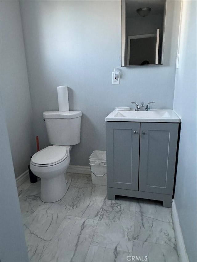 bathroom featuring toilet and vanity