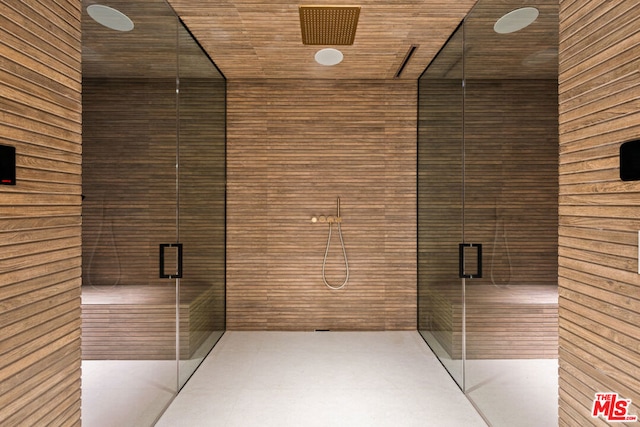 bathroom with wood ceiling and wood walls